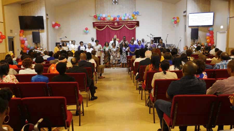 Church worship service with congregation and choir celebrating together