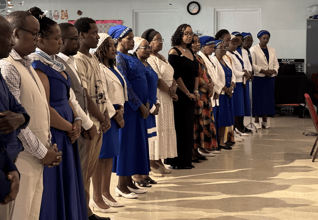 Church congregation members gathered together in prayer